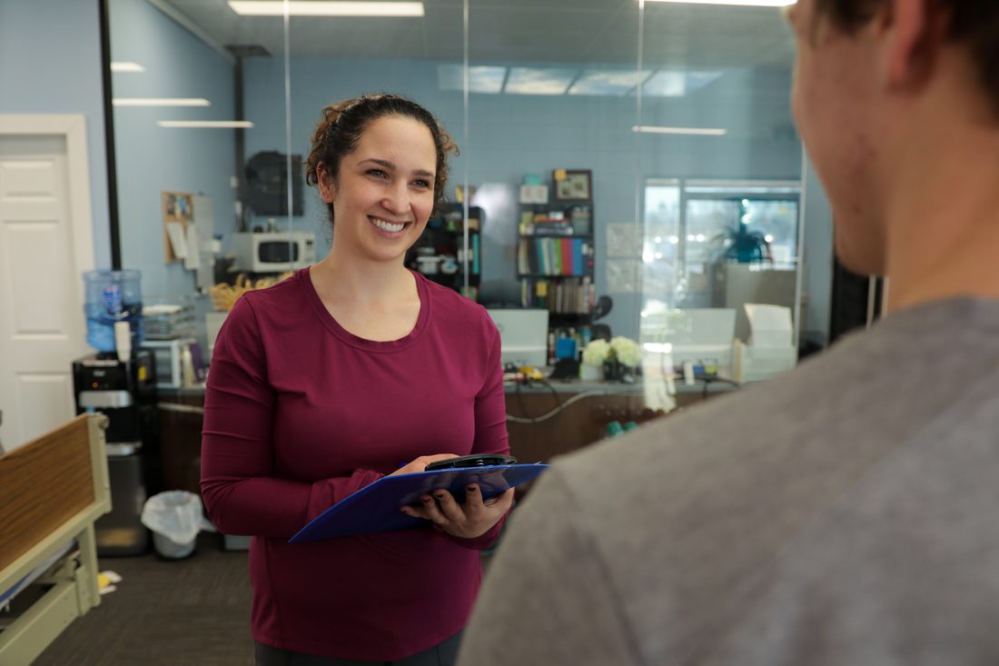 Physiotherapist talking with a patient during an assessment at Jannalee Physiotherapy
